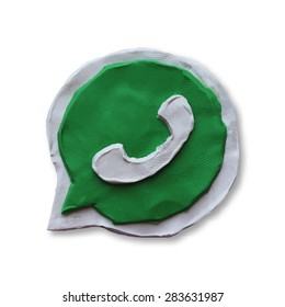 Green phone handset in speech bubble icon. Vector illustration. Plasticine modeling.