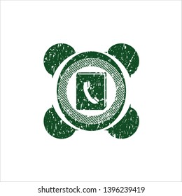 Green phonebook icon inside rubber stamp