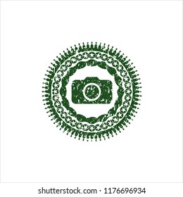 Green photo camera icon inside distressed grunge style stamp