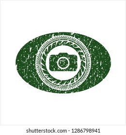 Green photo camera icon inside rubber seal