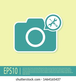 Green Photo camera with screwdriver and wrench icon isolated on yellow background. Adjusting, service, setting, maintenance, repair, fixing.  Vector Illustration