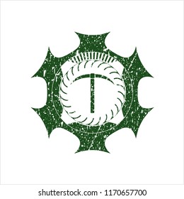 Green pickaxe icon inside distress rubber stamp with grunge texture