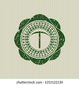 Green pickaxe icon inside distress rubber seal