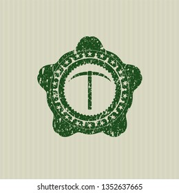 Green pickaxe icon inside distress grunge stamp