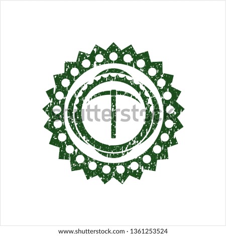 Green pickaxe icon inside grunge seal