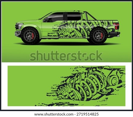A green pickup truck showcasing a unique graphic design and a detailed shock absorber illustration.