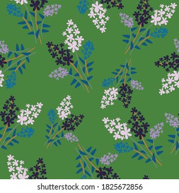 Green with pink and purple, white and blue flowers seamless pattern background design.