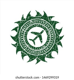 Green plane icon inside distressed rubber seal with grunge texture