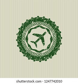 Green plane icon inside rubber grunge texture stamp