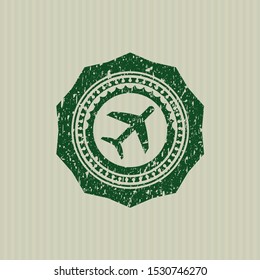 Green plane icon inside rubber grunge texture stamp