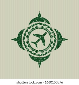 Green plane icon inside rubber grunge texture seal