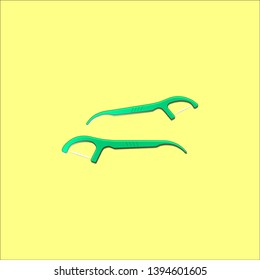 green plastic toothpick or dental floss pick for clean you teeth and protect your mouth from food debris and plaque