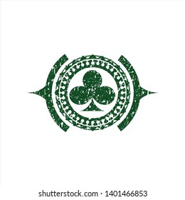 Green poker clover icon inside distressed rubber seal with grunge texture
