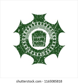 Green popcorn icon inside rubber texture