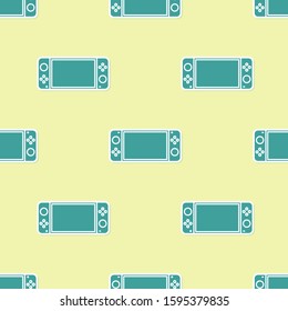 Green Portable video game console icon isolated seamless pattern on yellow background. Gamepad sign. Gaming concept.  Vector Illustration