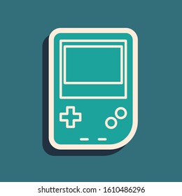 Green Portable video game console icon isolated on blue background. Gamepad sign. Gaming concept. Long shadow style. Vector Illustration
