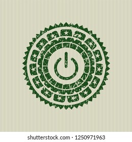 Green power icon inside distressed grunge stamp