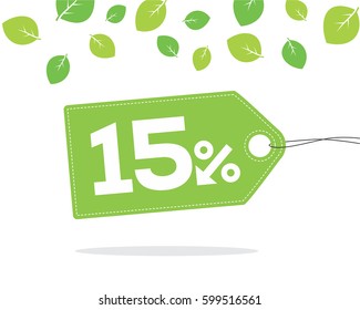 Green price tag label with 15% text designed with an arrow percent icon and stitches on it on white background with leaves and shadow. For spring and summer sale campaigns.