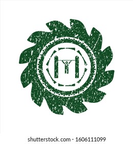 Green pull up icon inside distress rubber stamp with grunge texture