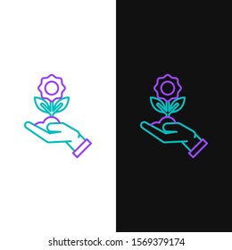 Green and purple line Hand holding flower icon isolated on white and black background. Seed and seedling. Planting sapling. Ecology concept.  Vector Illustration