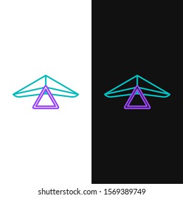 Green and purple line Hang glider icon isolated on white and black background. Extreme sport.  Vector Illustration