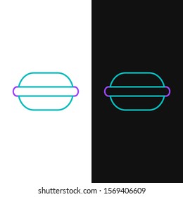 Green and purple line Macaron cookie icon isolated on white and black background. Macaroon sweet bakery.  Vector Illustration