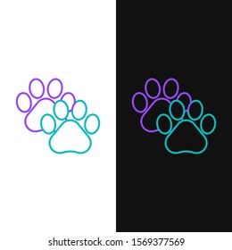 Green and purple line Paw print icon isolated on white and black background. Dog or cat paw print. Animal track.  Vector Illustration