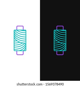 Green and purple line Sewing thread on spool icon isolated on white and black background. Yarn spool. Thread bobbin.  Vector Illustration
