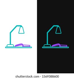 Green and purple line Workplace with table lamp and open book icon isolated on white and black background. Table office lamp.  Vector Illustration