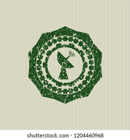 Green radar icon inside distressed rubber stamp with grunge texture