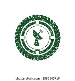 Green radar icon inside distressed rubber stamp with grunge texture