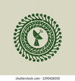 Green radar icon inside rubber seal