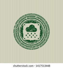 Green rain icon inside rubber stamp with grunge texture