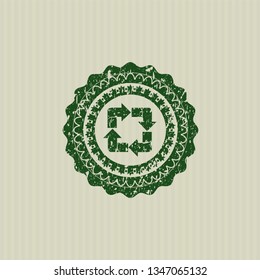 Green recycle icon inside distress rubber seal