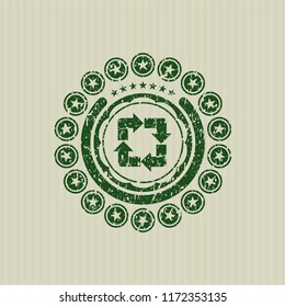 Green recycle icon inside distressed rubber stamp