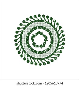 Green recycle icon inside distressed grunge stamp