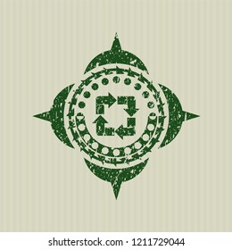 Green recycle icon inside distressed grunge style stamp