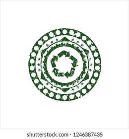 Green recycle icon inside distressed grunge style stamp