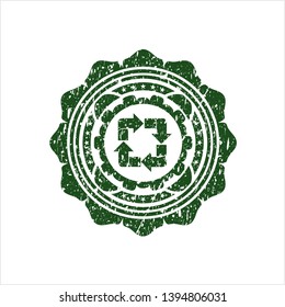 Green recycle icon inside distressed rubber seal with grunge texture