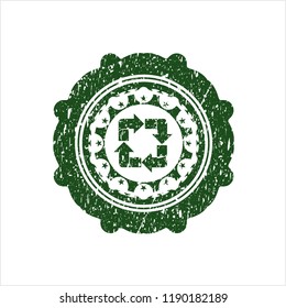 Green recycle icon inside rubber grunge texture seal