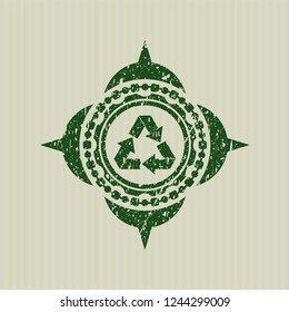 Green recycle icon inside rubber texture