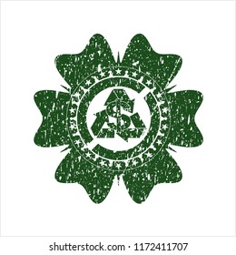 Green recycling business icon inside rubber grunge texture seal