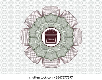 Rosette abstracto verde y rojo con icono de palomitas en el interior
