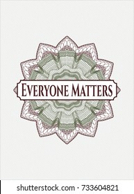 Green and Red passport money style rossete with text Everyone Matters inside