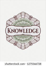 Green and Red passport style rosette with text Knowledge inside