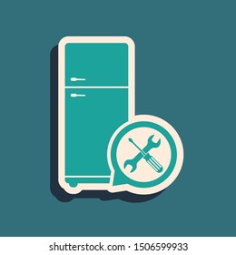 Green Refrigerator with screwdriver and wrench icon isolated on blue background. Adjusting, service, setting, maintenance, repair, fixing. Long shadow style. Vector Illustration