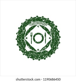 Green restaurant icon inside distressed rubber stamp with grunge texture
