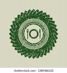 Green restaurant icon inside distressed rubber stamp with grunge texture