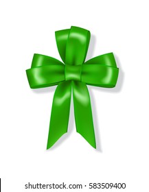 Green ribbon with bow folded in the form of leaf clover isolated on white background.