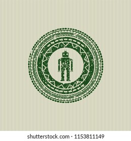 Green robot icon inside distressed rubber grunge texture seal